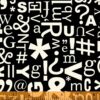 תמונה של בד דגם Typecast-Glyphs Black עם סגנון דוגמה מקטגורית מילים, אותיות ומספרים ובעל צבע Black